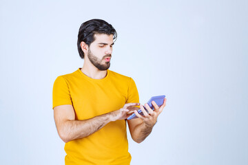 Canvas Print - Man working with calculator and thinking