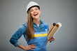 Woman builder in safety helmet holding blueprints rolls. Isolated female portrait.