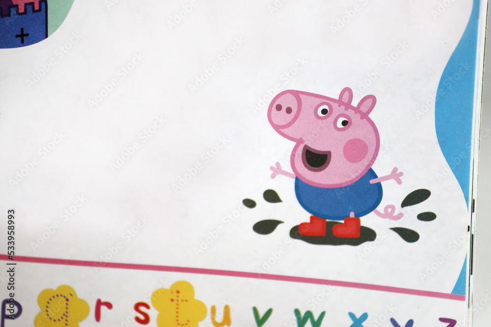 George the little brother of Peppa Pig jumping in mud puddles with his ...