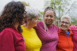 © Sabrina - Multi generational women hugging each other at city park - Multiracial people having fun outdoor
