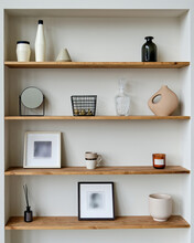 Wooden Shelves With Beautiful Decorative Elements, Basket, Photo Frame, Mirror, Vase