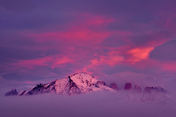 Wall Mural - Winter twilight lanscape from Patagonia moutains with snow. Lago Nordenskjold, Torres del Paine National Park, Chile. Pink blue evening sky. Traveling in Chile,  hills in Torres del Paine NP.