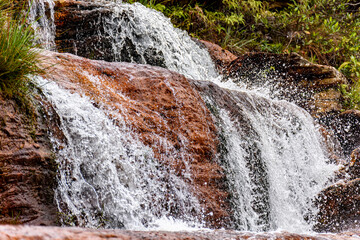 Wall Mural - Detail of a small waterfall with water running over the rocks of the Biribiri environmental reserve in Diamantina, Minas Gerais