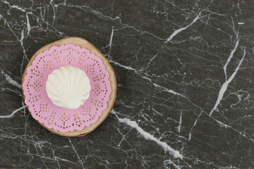 Wall Mural - Top view of Fresh white marshmallow on pink napkin over wooden board