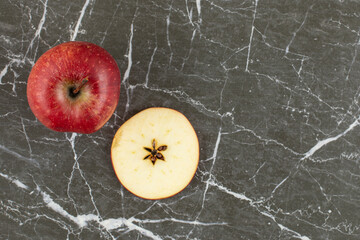 Wall Mural - Top up view of fresh red apple. whole and sliced