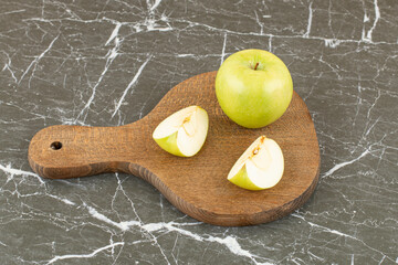 Wall Mural - Fresh organic apples. whole and sliced on wooden board