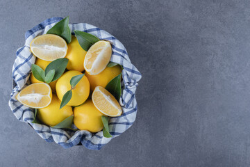 Wall Mural - Top view of fresh organic lemons and slices