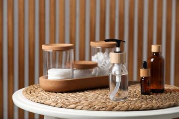 Wall Mural - Bottle with dispenser cap and essential personal hygiene products on table indoors