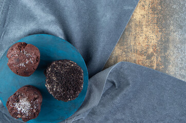 Wall Mural - A blue wooden board with chocolate cakes