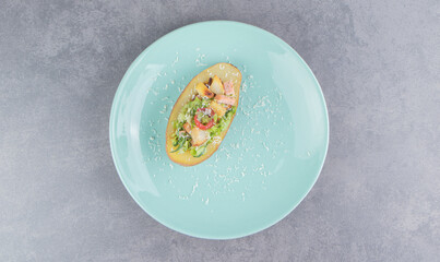 A plate of fresh salad on the marble background