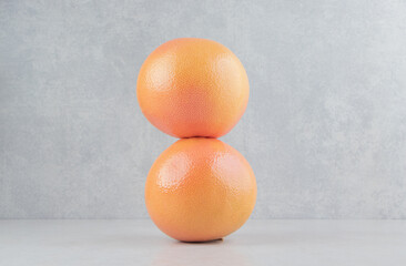 Wall Mural - Two fresh oranges on stone background