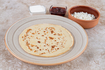 Wall Mural - A plate of roll pancakes with cottage cheese