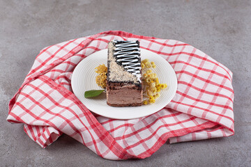 Wall Mural - Slice of chocolate cake on white plate