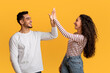 © Prostock-studio - Portrait Of Happy Young Arab Couple Giving High Five To Each Other