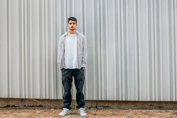 Poster - young man standing in the street with space for text or ad