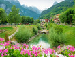 Moleno town and blue Molveno lake  at the foot of the Brenta Dolomites,