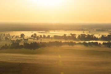 Sticker - Aerial shot of misty sunrise full of sun 