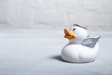 White Rubber Duck For A Bath In The Form Of An Angel On A Light Background.