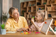 © Prostock-studio - Foreign language classes for preschoolers. Clever pretty kid girl learning alphabet, pronouncing and making words