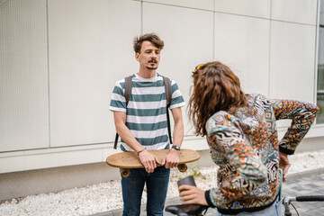 modern couple man woman male and female student talk in day outdoor