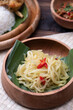 Stir fry or sauteed chayote squash or tumis labu siam is Indonesian daily dish. Simple and easy to cook. Served in wooden bowl on wooden table. Selective Focus. Landscape