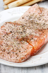 Canvas Print - Raw salmon with herbs. Preparing meal