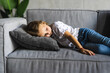 © F8  \ Suport Ukraine - Close up little girl taking day nap, sleeping on cozy comfortable couch at home, cute adorable kid child with closed eyes lying resting on sofa, enjoying healthy sleep, falling asleep alone