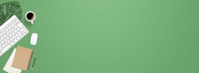 Fototapete - Flat lay work desk table with computer , book , coffee on green pastel color tone background include empty space for product or text graphic advertise