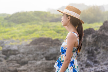 Wall Mural - Woman look at the scenery view under sunset