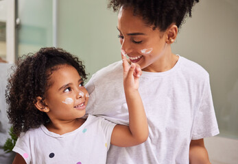 happy family, mother and girl with cream skincare on face in the morning to bond in mexico home. smi