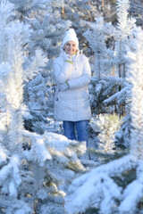 Canvas Print - Old woman in a fur coat in the winter 