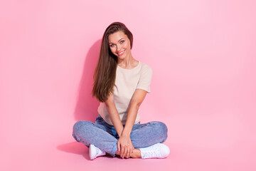 Poster - Full length photo of adorable satisfied person sit floor crossed legs isolated on pink color background