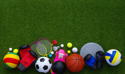 Wall Mural - Sports equipment on green grass