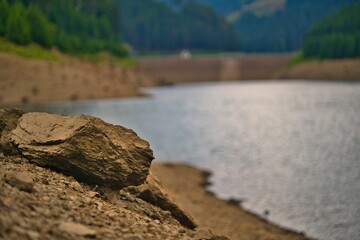 Closeup shot of the rocks on the shore of the Goldisthal pumped storage plant in Germany