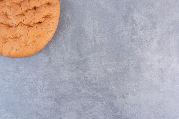 Wall Mural - Round loaf of bread on marble background