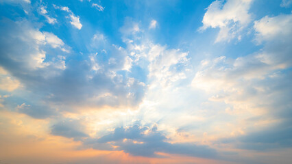 Wall Mural - sunset or sun rise sky with rays of  light shining clouds and sky background and texture