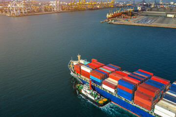 Wall Mural - Aerial view of cargo ship and cargo container in harbor.