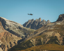 View Of An Army Helicopter In The Dolomites, Italy.