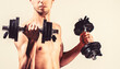 © Yevhen - Weak man lift a weight, dumbbells, biceps, muscle, fitness. Nerd maleraising a dumbbell