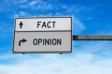 Fact versus opinion road sign.