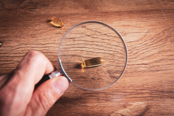 Wall Mural - magnifier and pills on the table