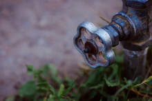 Outdoor Water Faucet. Connecting Irrigation Systems. Watering Garden Plants. Vintage Old Gate Valve. Antique Bronze Valve.