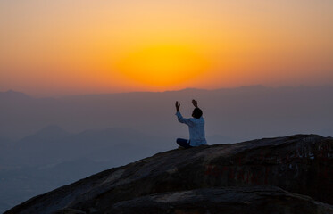 People praying to god at sunset.