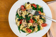 tortellini salad  with spinach tomatoes  and mushrooms,