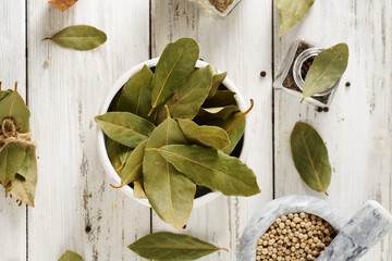 bay leaves on light wooden boards