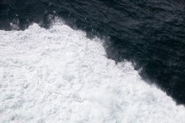 Wall Mural - Waves in the ocean from a ship 