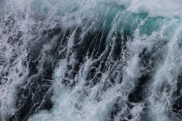 Wall Mural - Waves in the ocean from a ship 
