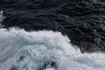 Wall Mural - Waves in the ocean from a ship 
