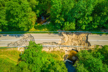 The Asphalt Road And Bridge Washed Out And Destroyed After The Heavy Rain And Flood. Aerial Photo