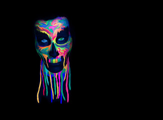 Wall Mural - Skull mask with vivid UV color. Spooky concept. Halloween or Santa Muerte concept. Retro background of the future with black light.